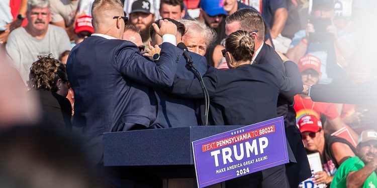 The Secret Service immediately surround former President Trump after he was shot during his campaign stop at the Butler Farm Show grounds on Saturday, July 13, 2024.

Ralph LoVuolo / Special to the Butler Eagle