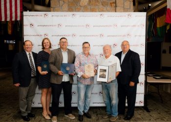 Pictured, from left to right, are: Shane Oschman (chair of the PA Wilds Board of Directors), Sen. Bob Casey's aide Liz Cooper, Congressman Glenn Thompson's aide Brad Moore, award recipient Kenn Starr, award recipient Ken Starr, and state Rep. Mike Armanini.