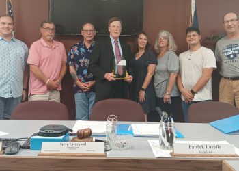 Chip Bell (center) received an award from Clearfield Borough Council in honor of his over 30 years of service to the area.