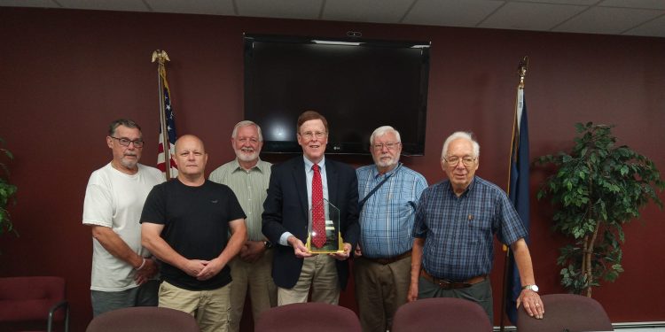 Current Clearfield Borough President Steve Livergood, Clearfield Regional Police Chief Vincent McGinnis, and former borough council members, Larry Mack, Harvey Haag and Jim Leitzinger gathered on Friday to honor F. Cortez “Chip” Bell III, (center) who is retiring after 34 years as the borough’s solicitor. (Julie Rae Rickard).