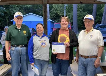 Pictured, from left to right, are:  Martin Tate, GLC president; Erin Dimmick, sponsoring Lion; Kimmy Wheeler, new member; and Jim Bennett, GLC  installing officer.