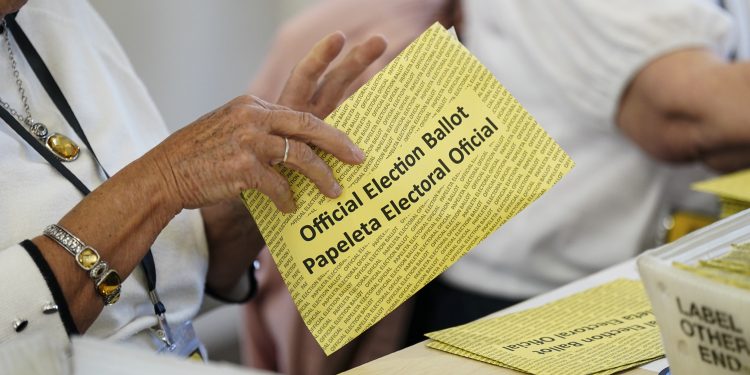 Workers sort mail ballots on primary Election Day 2024 at Northampton County Courthouse in Easton, Pennsylvania.

Matt Smith / For Spotlight PA