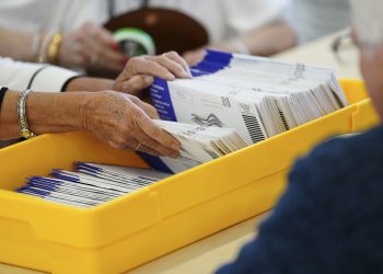 Workers sort mail ballots on primary Election Day 2024 at Northampton County Courthouse in Easton, Pennsylvania.

Matt Smith / For Spotlight PA