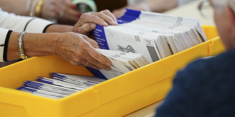 Workers sort mail ballots on primary Election Day 2024 at Northampton County Courthouse in Easton, Pennsylvania.

Matt Smith / For Spotlight PA