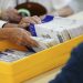 Workers sort mail ballots on primary Election Day 2024 at Northampton County Courthouse in Easton, Pennsylvania.

Matt Smith / For Spotlight PA