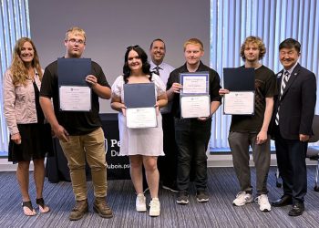 Students and staff members gather for a group photo during the graduation ceremony for the post high school CNC program at Penn State DuBois. From left to right, Pam Streich, executive director of Workforce Solutions of North Central Pennsylvania; Luke Eckert; Skylar Bowers; John Brennan, director of continuing and community education at Penn State DuBois; Tyler Baughman; Hunter Tharp; and Jungwoo Ryoo, chancellor and chief academic officer at Penn State DuBois.

Credit: Penn State