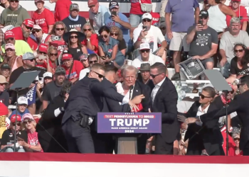 A bloodied former President Donald Trump is lifted from the podium floor after an assassination attempt in Butler, Pa., on Saturday, July 13, 2024.

Donald Trump campaign | Facebook