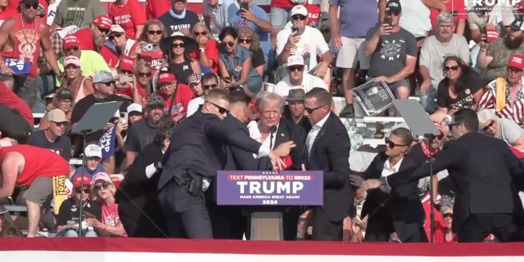 A bloodied former President Donald Trump is lifted from the podium floor after an assassination attempt in Butler, Pa., on Saturday, July 13, 2024.

Donald Trump campaign | Facebook