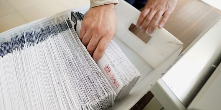 Mail-in ballots are sorted and counted by workers on Election Day in Northampton County. Pennsylvania lawmakers instituted no-excuse mail voting for the first time in 2019.

Matt Smith / For Spotlight PA