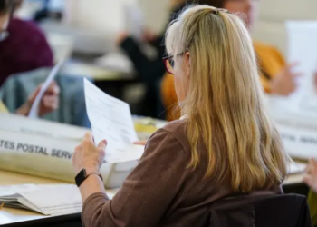 Workers sort mail ballots on primary Election Day 2024 at Northampton County Courthouse in Easton, Pennsylvania.

Matt Smith / For Spotlight PA