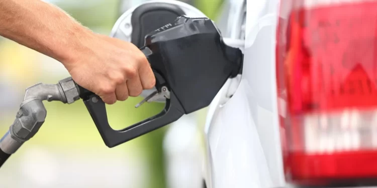 Pumping gasoline into a vehicle. 

United States Secret Service